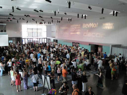 people gathered in a large open lobby